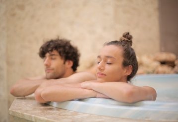 young satisfied couple relaxing at spa bathtub during 3852252 1